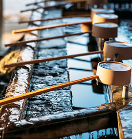 Water pond in Hokkaido shrine temple for cleaning or drinking at